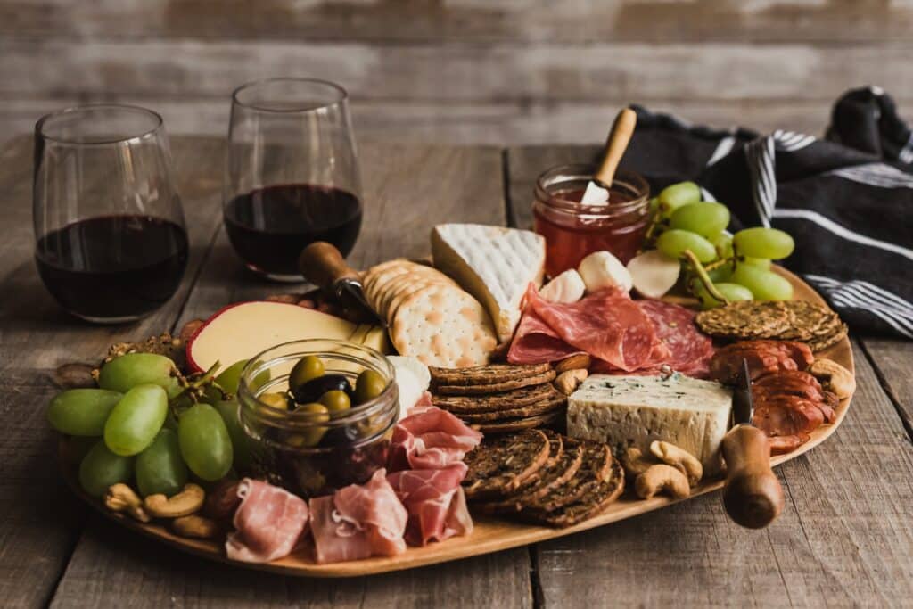 Charcuterie board with red cheese