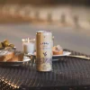 Single can of Lyre’s Classico sparkling RTD on table with appetizers