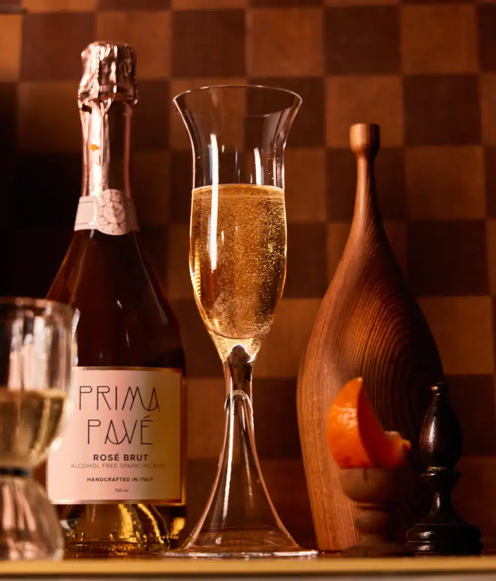 Prima Pave Rose Brut Lifestyle Image with full champagne glass
