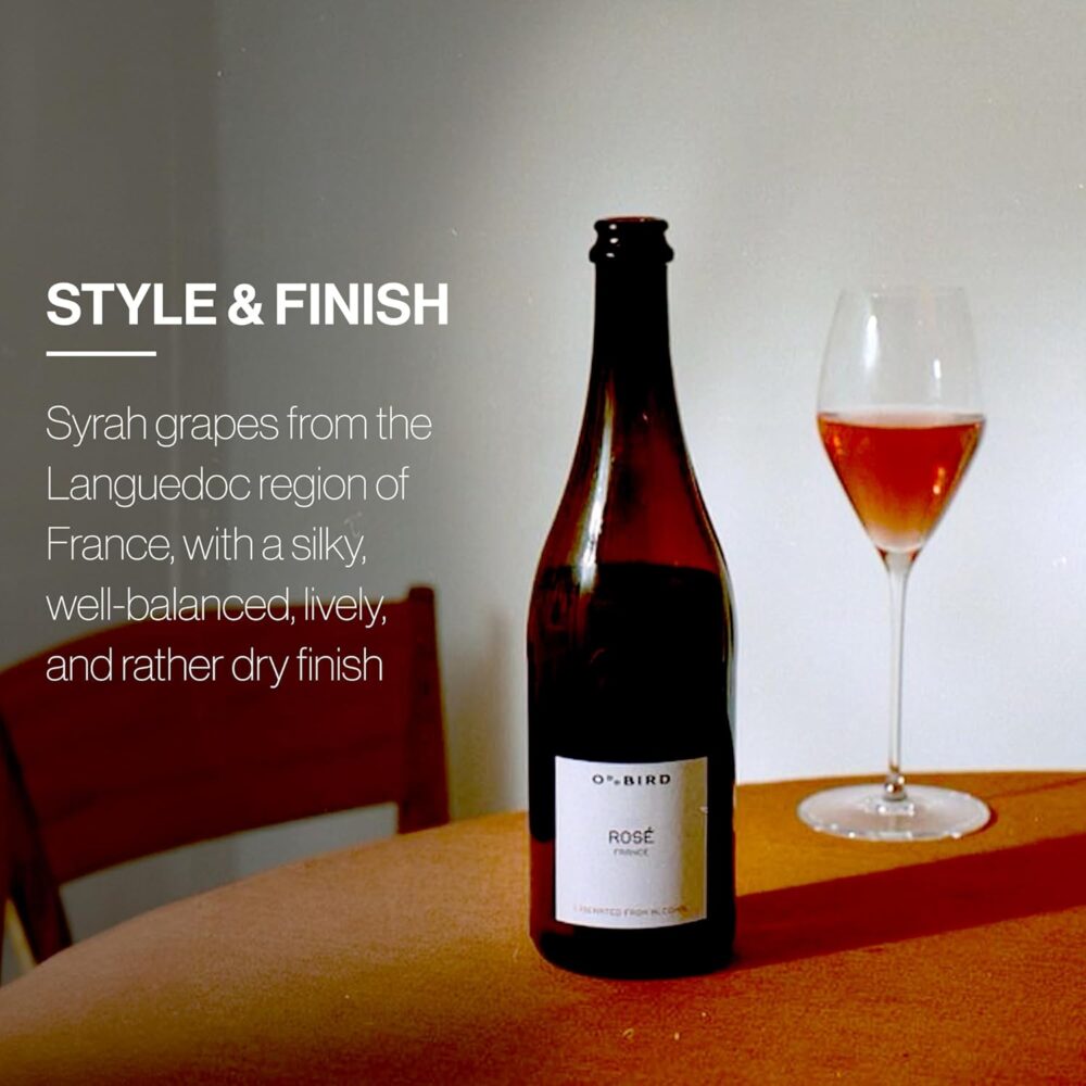 A glass and bottle of Oddbird Rosé on a table with text describing its silky, well-balanced, and dry finish made from Syrah grapes.