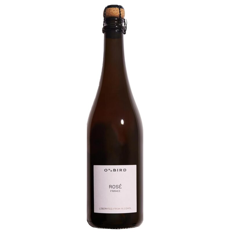 Straight-on image of Oddbird Sparkling Rosé bottle with minimal white label and cork top, standing against a plain background.