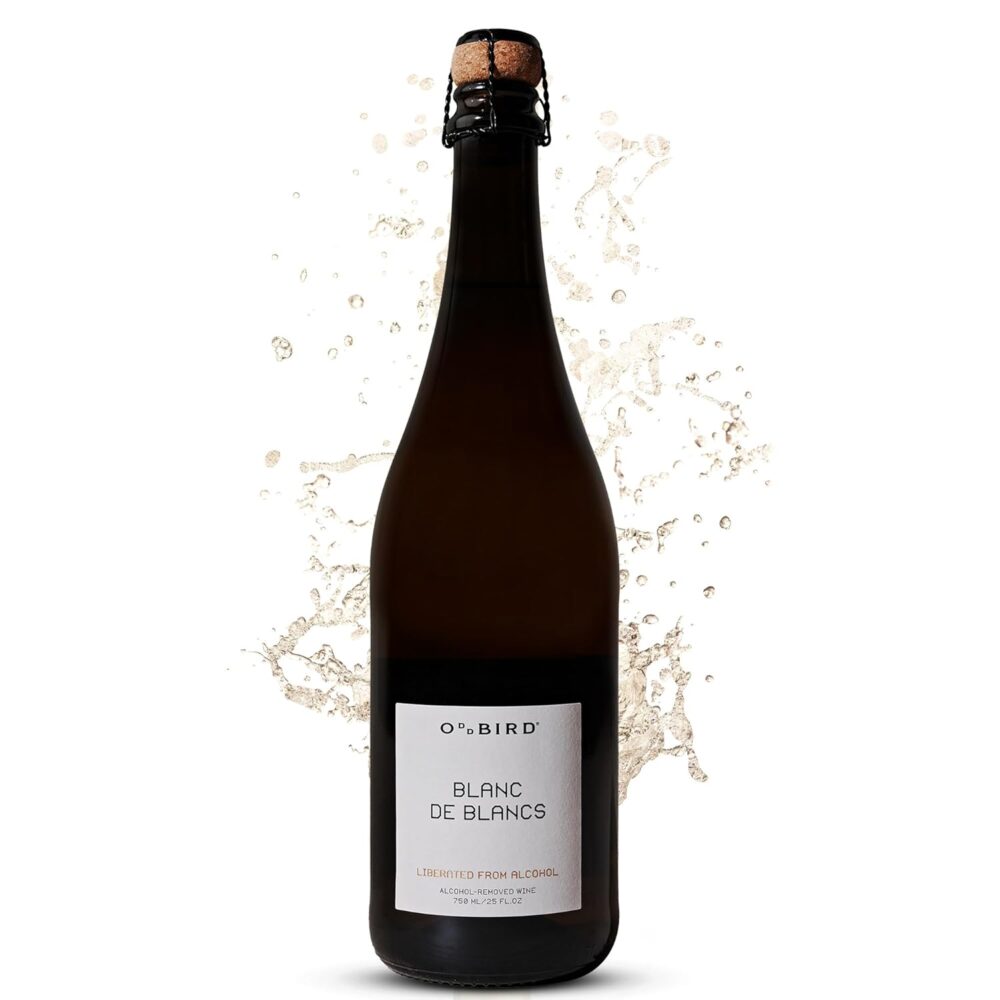 Oddbird Blanc de Blancs with bubbles splashing behind the bottle
