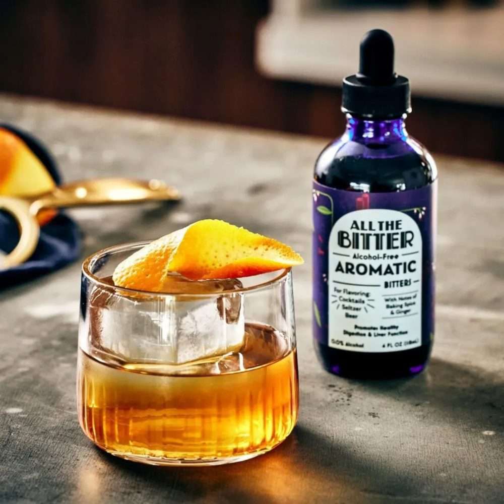 All The Bitter Aromatic Bitters bottle with old fashioned style cocktail garnished with orange peel