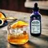 All The Bitter Aromatic Bitters bottle with old fashioned style cocktail garnished with orange peel