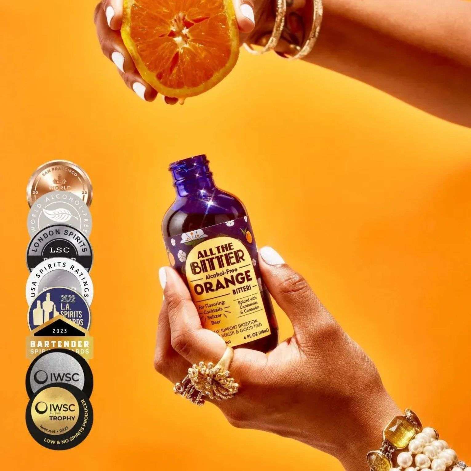 All The Bitter Orange Bitters award-winning bottle with fresh orange and medals