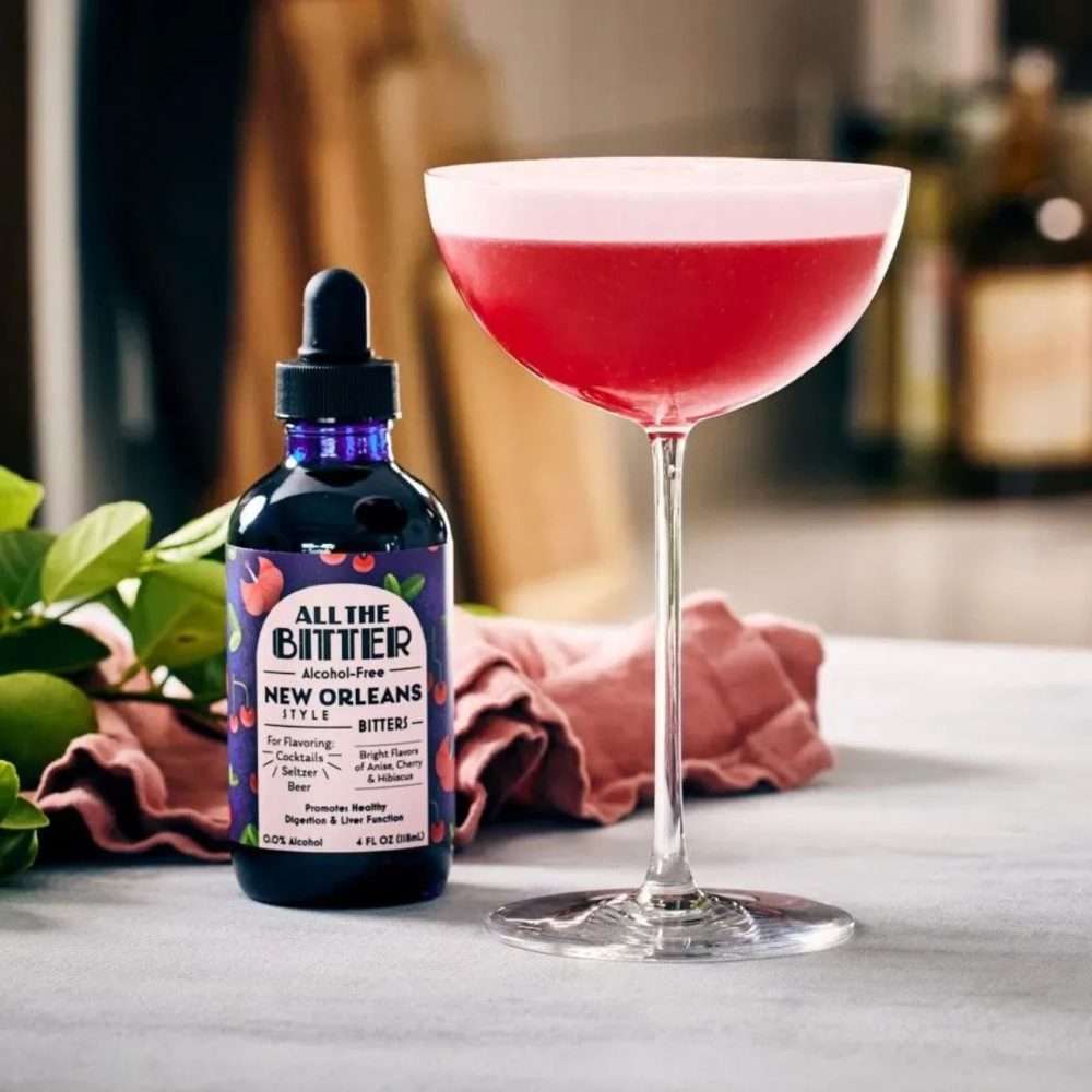 All The Bitter New Orleans Bitters with vibrant red non-alcoholic cocktail in coupe glass